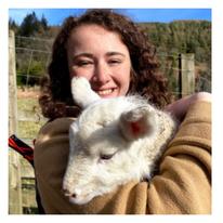 Girl holding goat